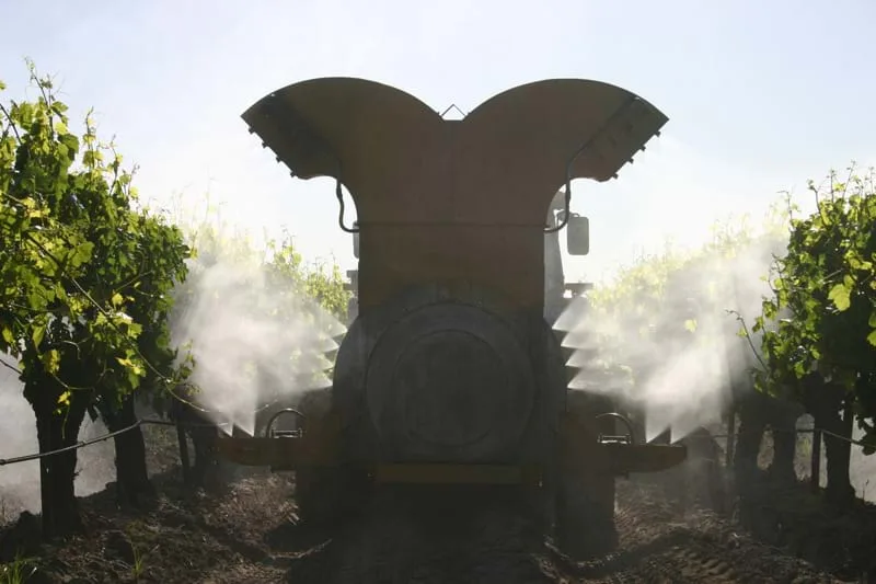Air-O-Fan orchard sprayer operating in the field