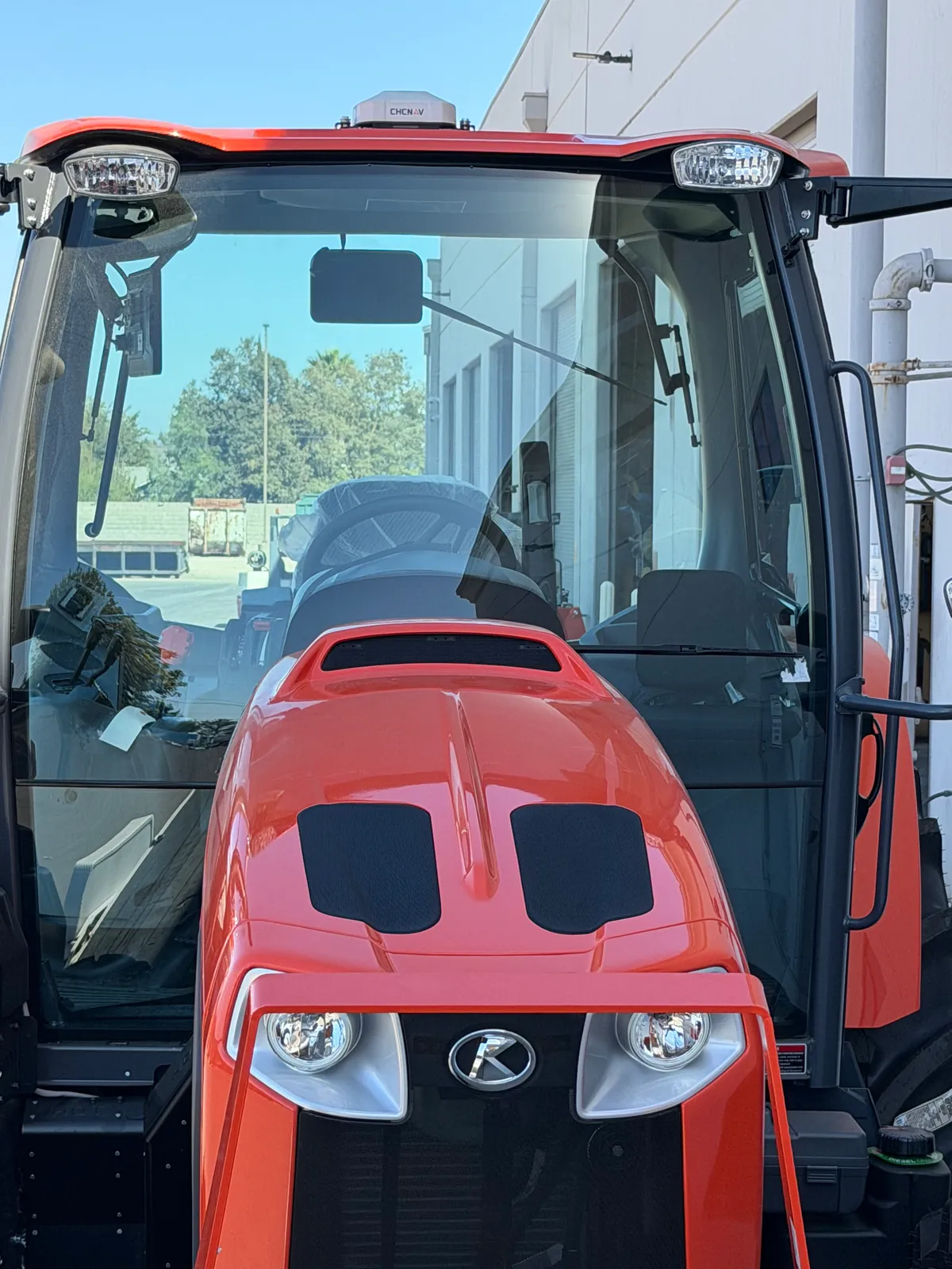 Kubota M6 tractor with a CHCNAV receiver on the cab roof