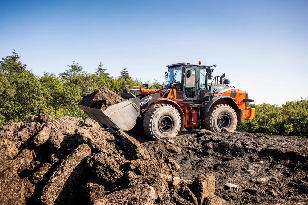 Hitachi wheel loader working in an agricultural material handling area