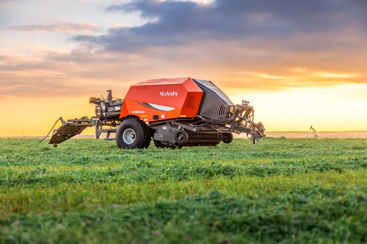 Kubota SSB small square baler working in a hay field
