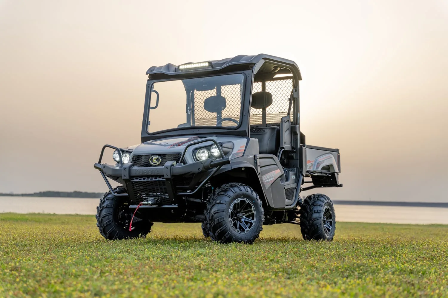 Kubota Sidekick utility vehicle beside a lake