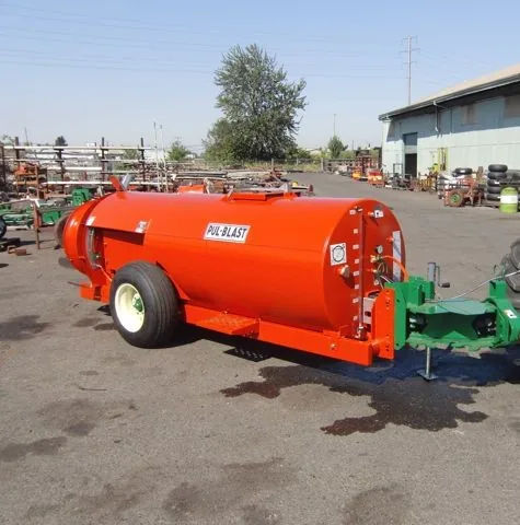 Rears Pul-Blast trailer sprayer in an equipment yard