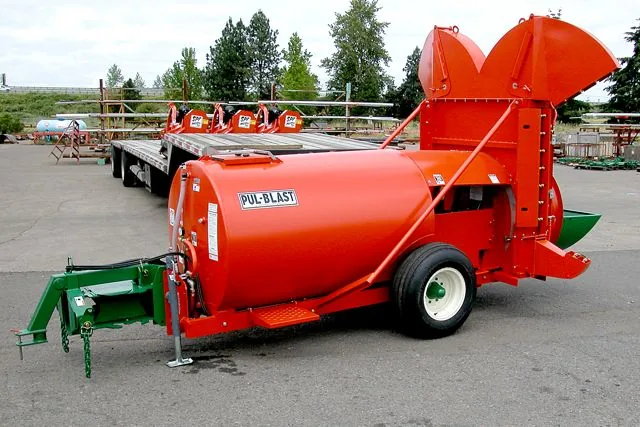 Rears Pul-Blast trailer sprayer in an equipment yard