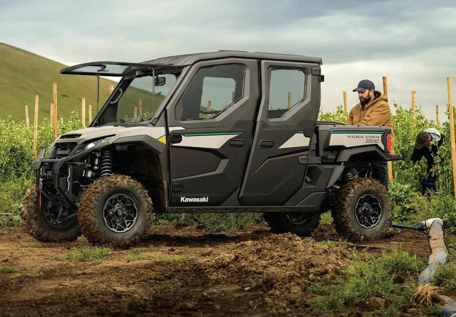 Kawasaki RIDGE CREW six-passenger side-by-side working in a field
