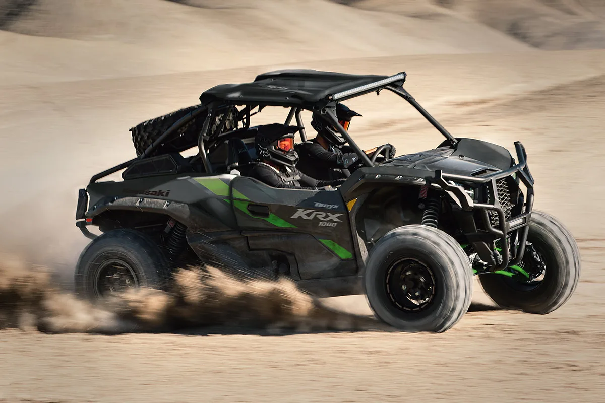 Kawasaki TERYX KRX 1000 side-by-side driving in sand, representative of the TERYX lineup