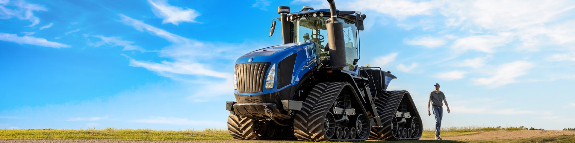 New Holland agricultural tractor working in a field