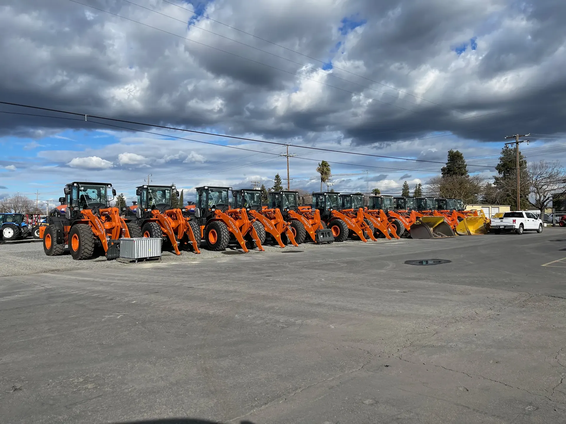 Construction equipment lined up at a Garton Tractor location