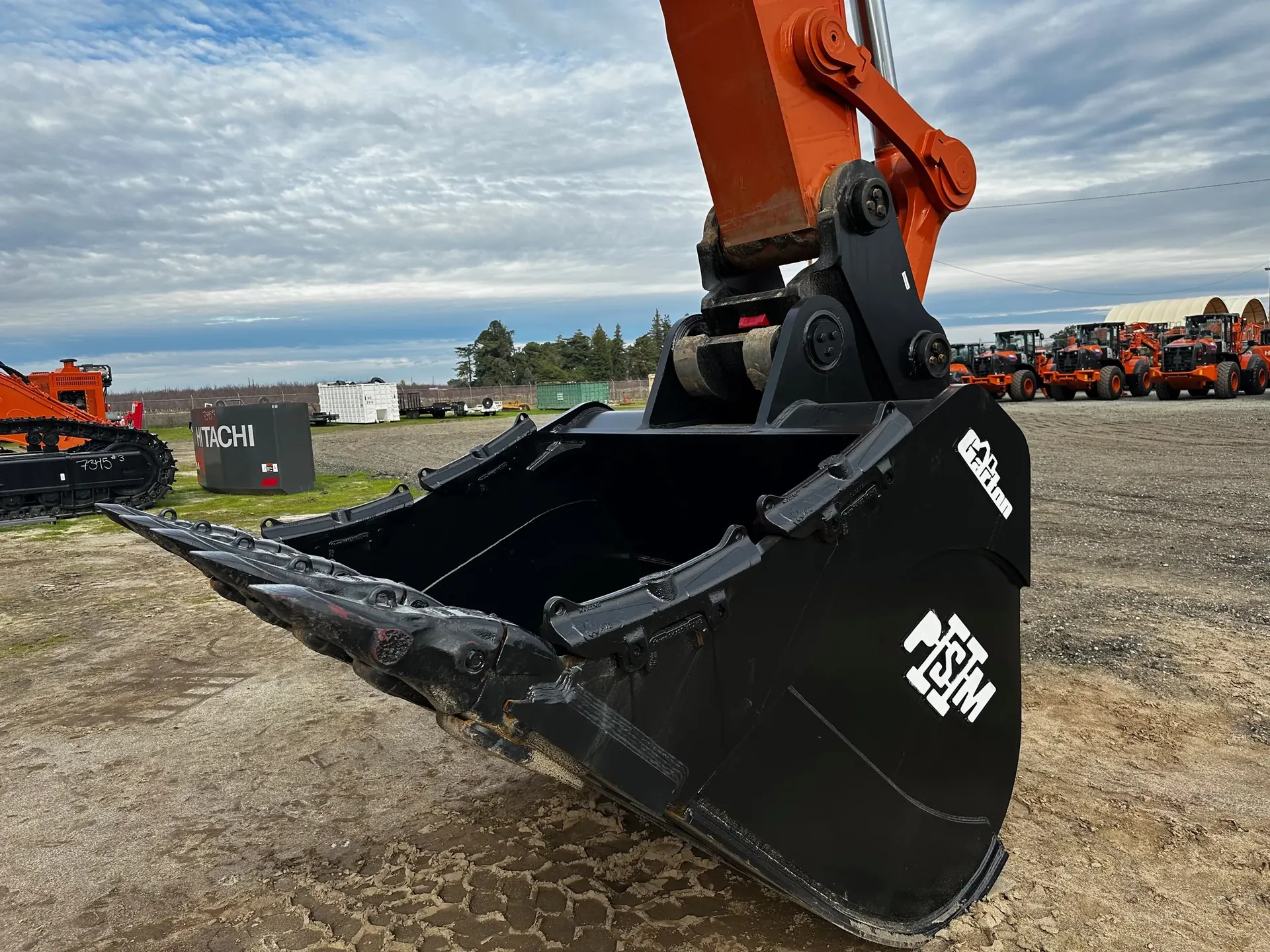PSM excavator bucket mounted on a Hitachi excavator