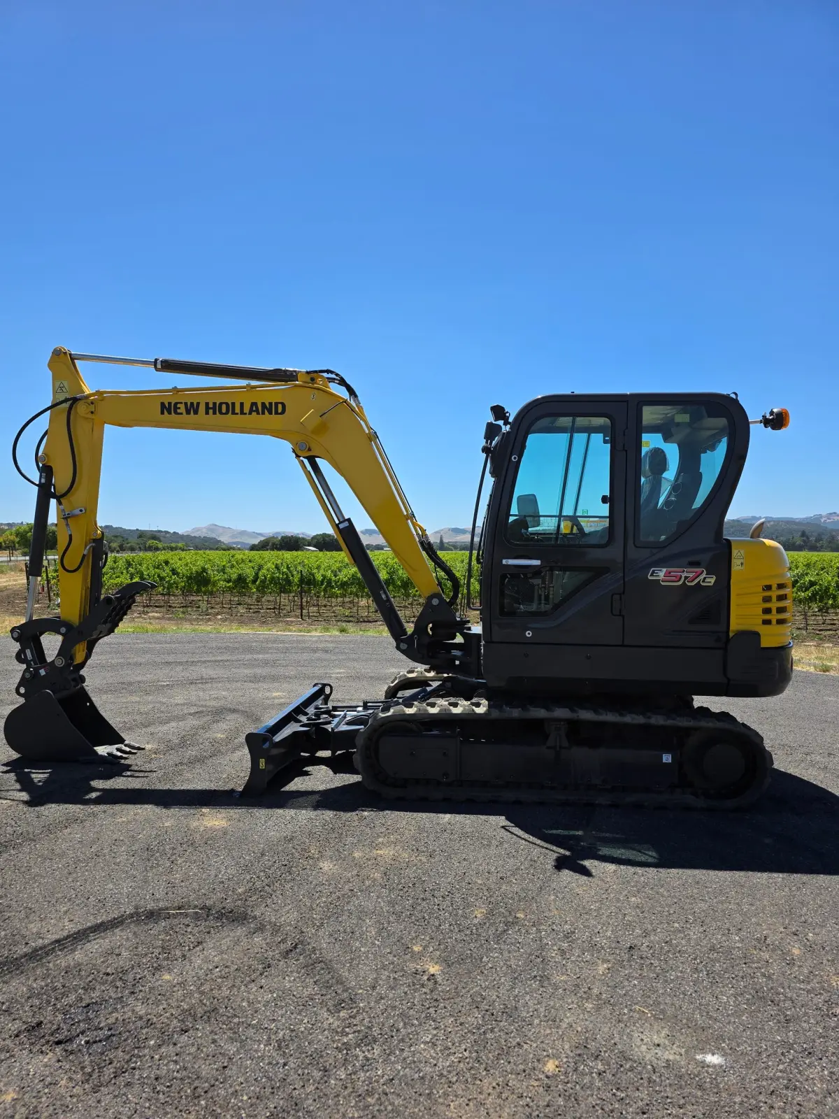 Actual stock photo 2 of New Holland E57C, stock 006901