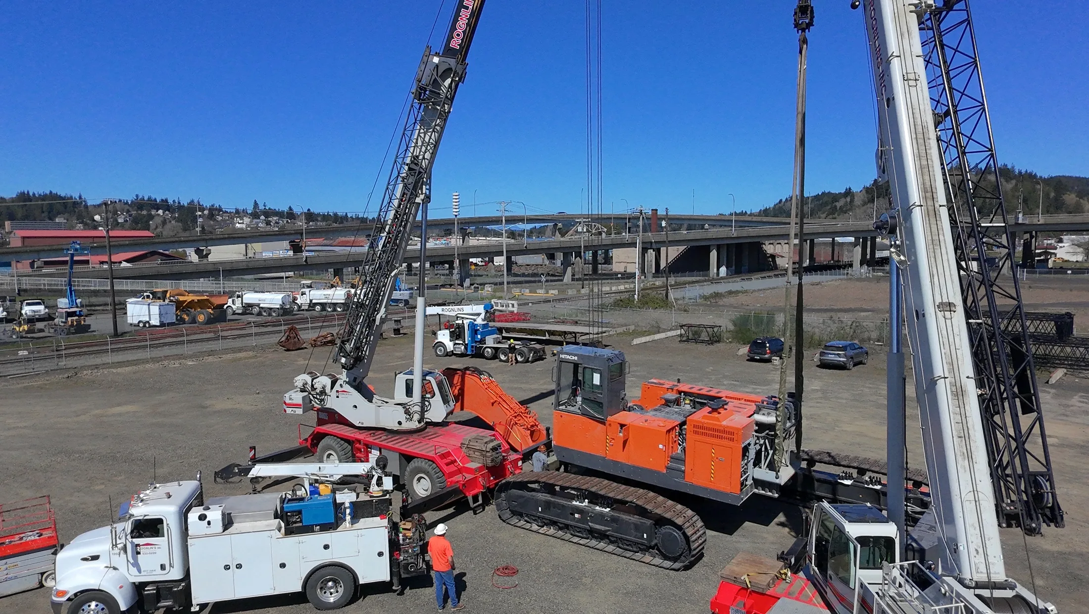 Construction equipment working across a large jobsite