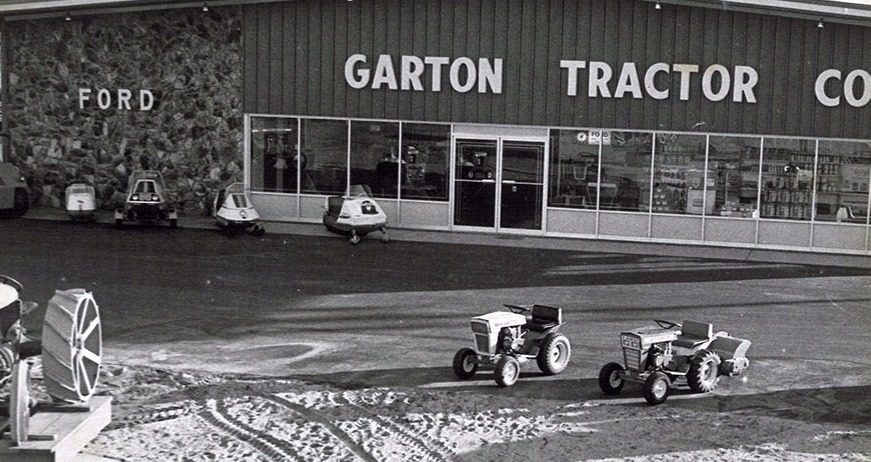 Garton Tractor Co. storefront on Center Street in Turlock with vintage Ford lawn tractors out front