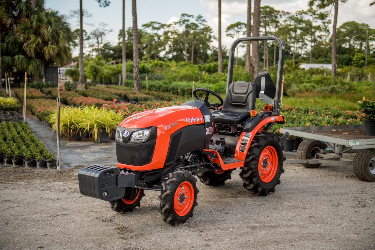 Kubota B2401 narrow tractor working at a plant nursery