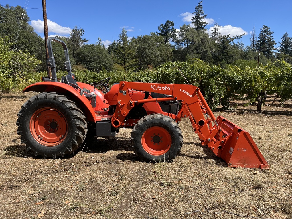Actual stock photo of Kubota M5660SUHD, stock 030323